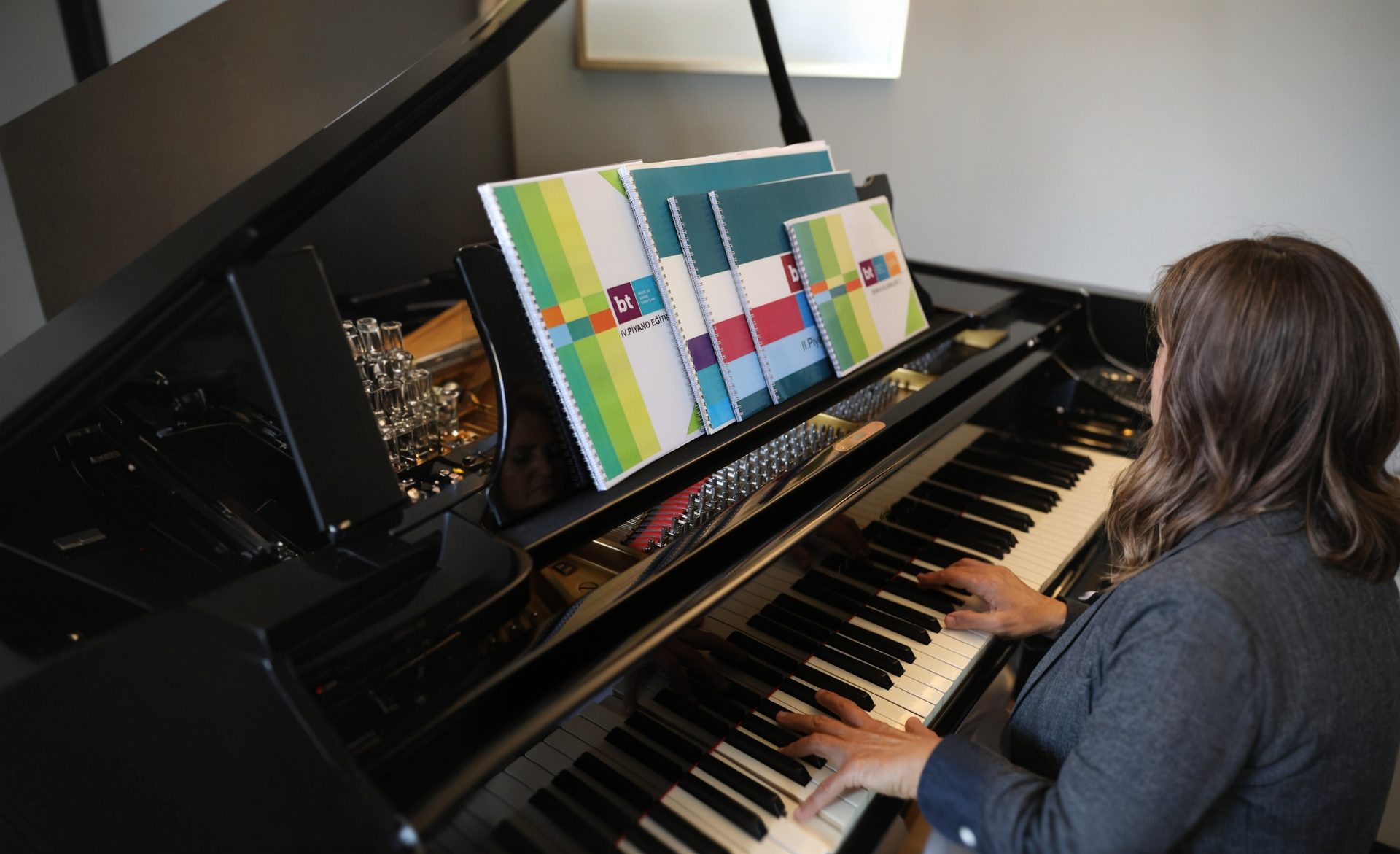 BT educational method books at the piano