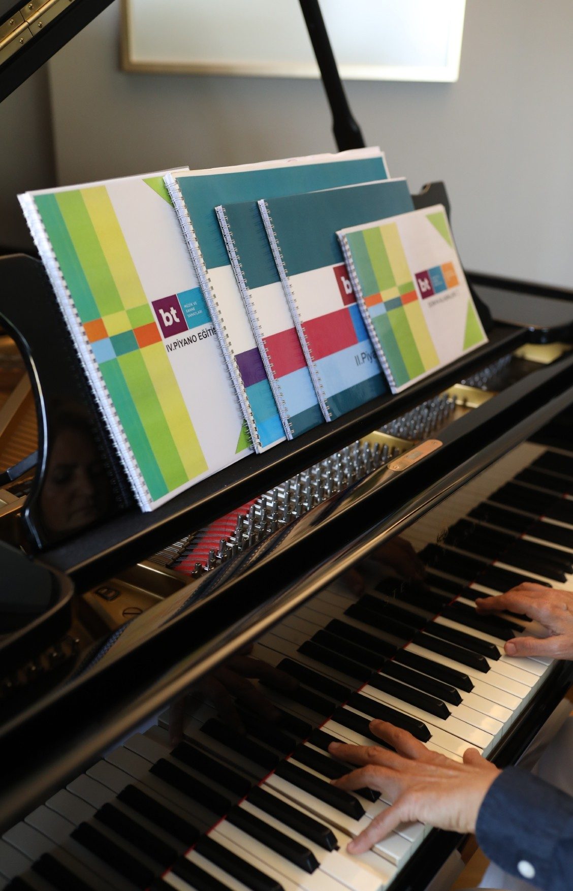 BT educational book series on a piano